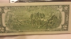 2003A ONE–TWO DOLLAR BILL UNCIRCULATED IN HOLDER.